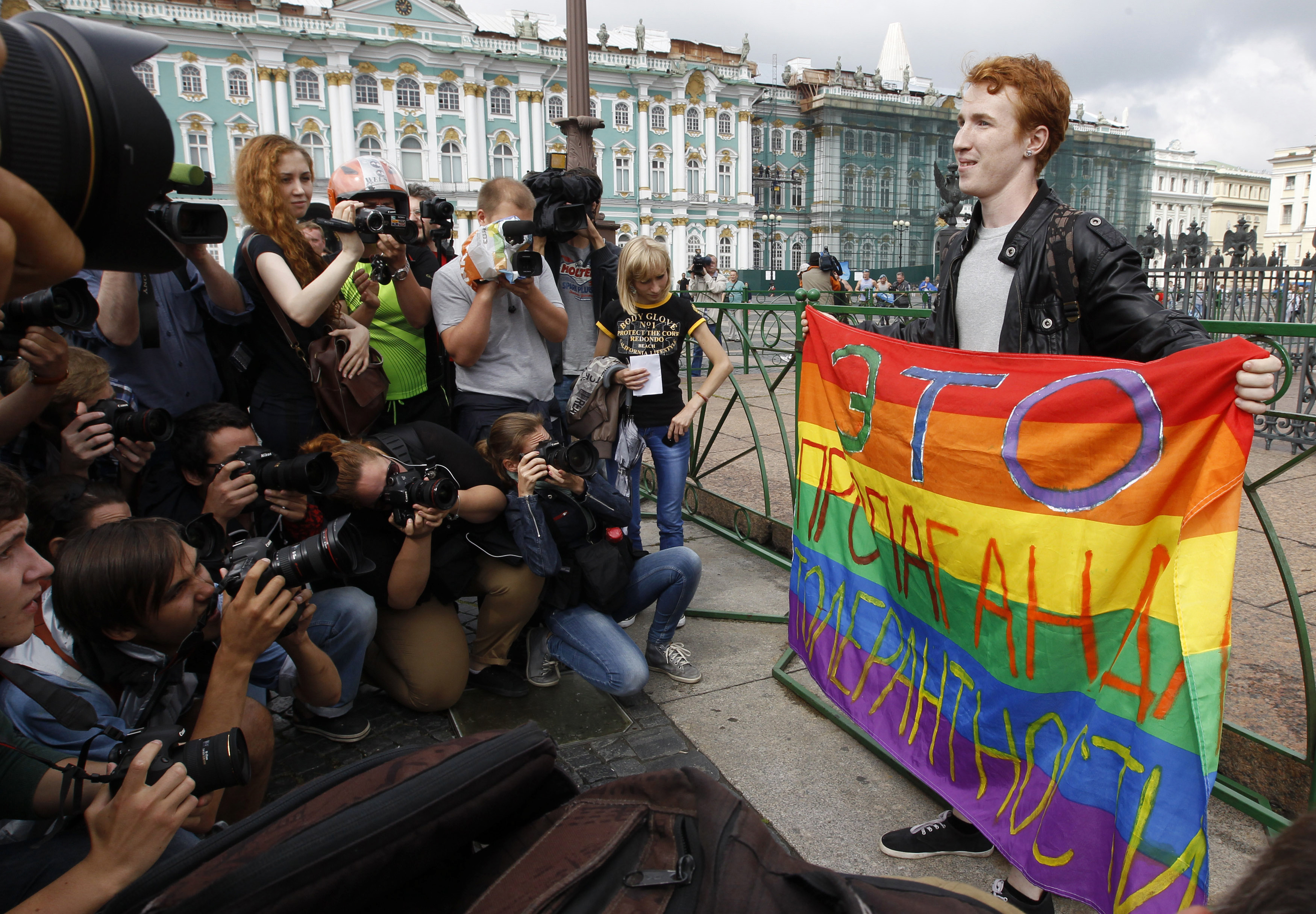 2 August 2013, Russia. Kirill Kalugin, an LGBT rights activist, poses for press during a one-man protest in St. Petersburg with a banner that reads, “This is propagating tolerance.