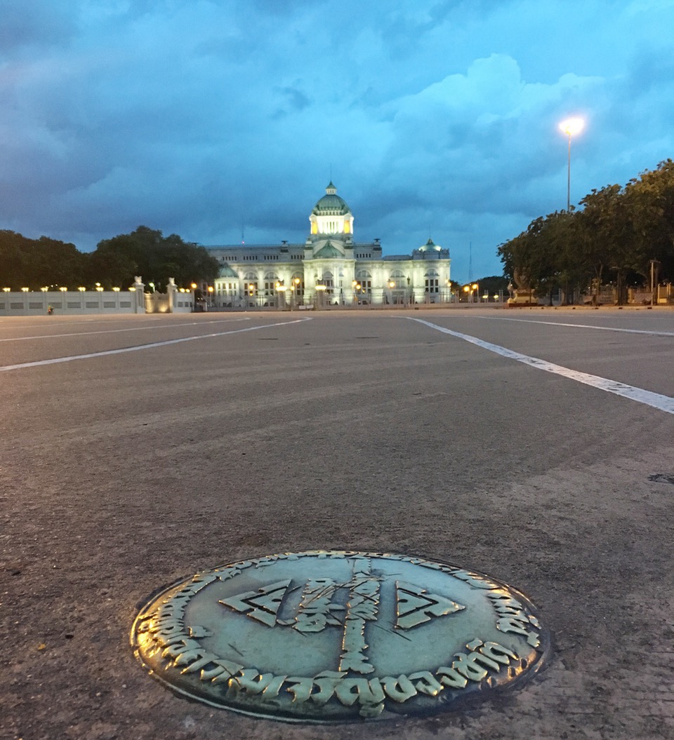 In this 2 October 2016, photo, a bronze plaque commemorating Thailand's 1932 revolution is seen in the Royal Plaza in front of the Ananta Samakhom throne hall in Bangkok